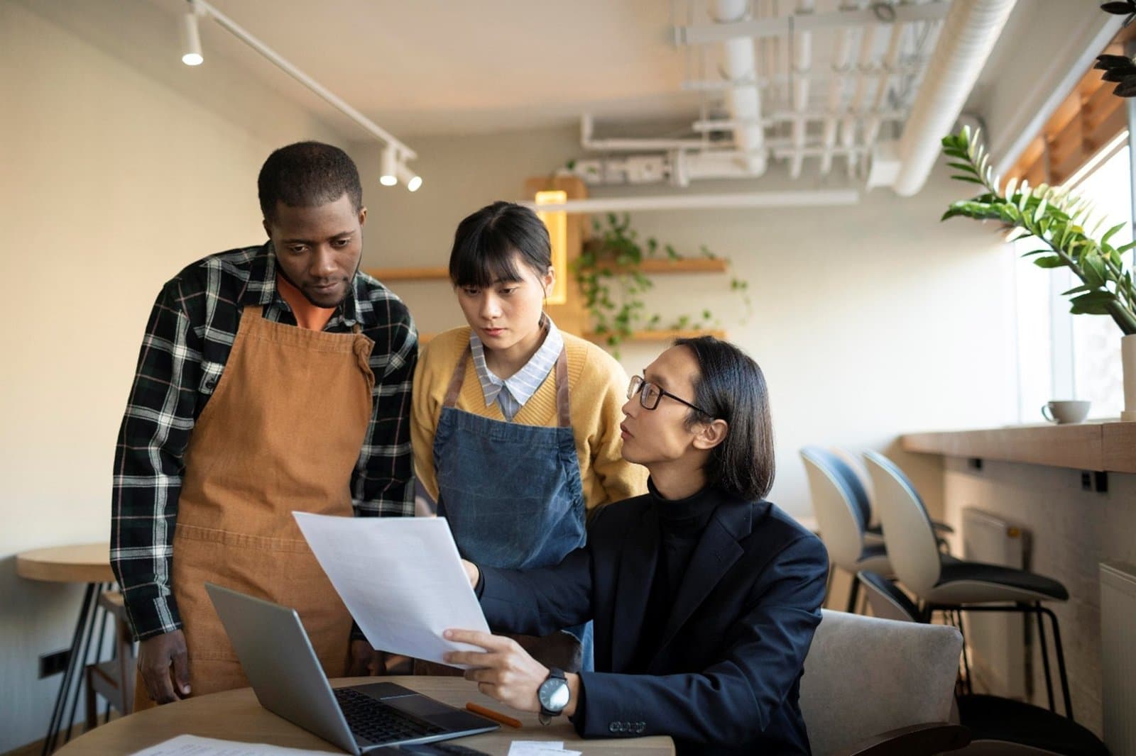 A small team reviewing a business document together