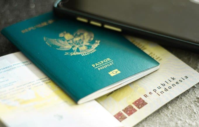 An Indonesian passport resting on other identity documents